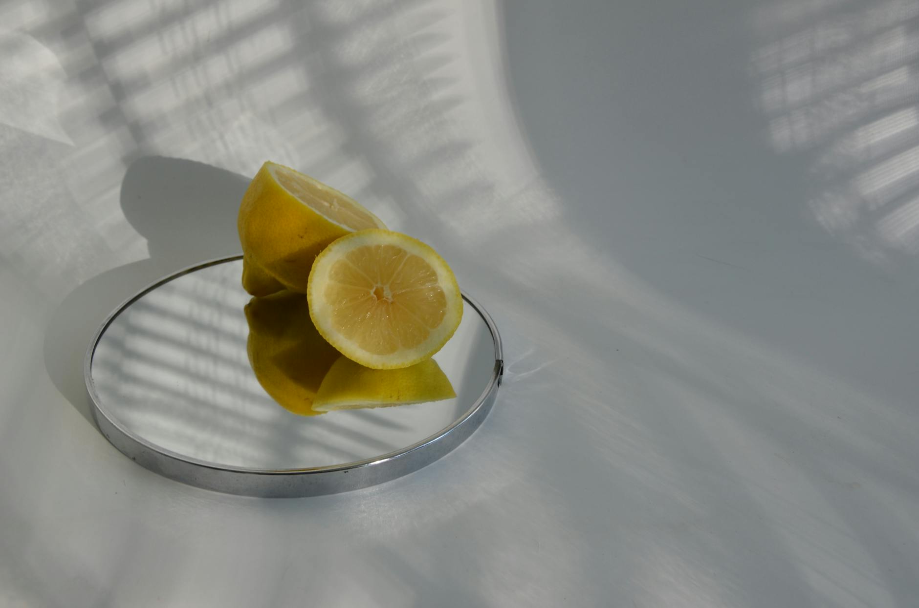 Vibrant collection of lemon clitoral vibrators and colorful toys arranged on a bright yellow surface